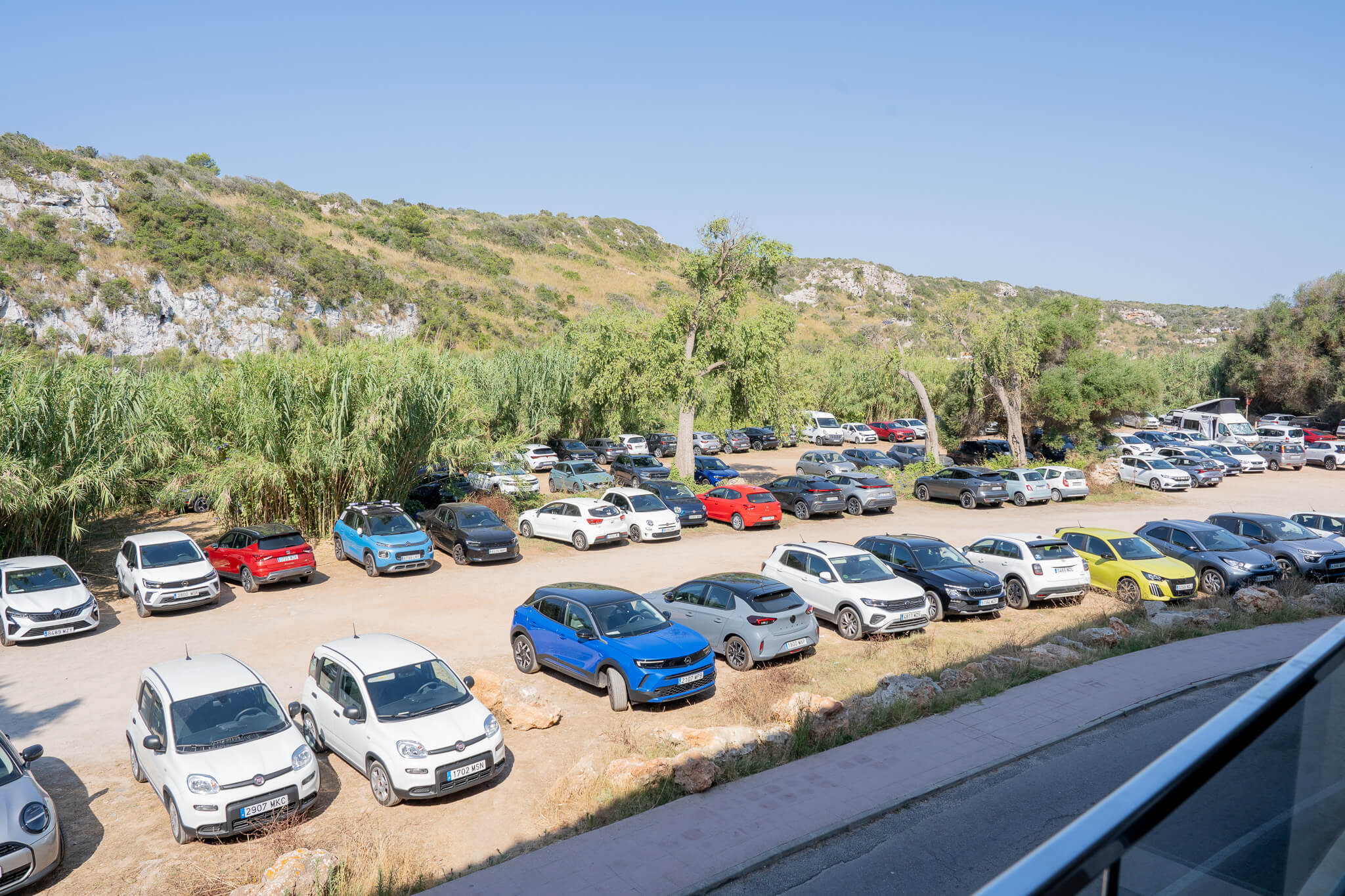 parking at cala en porter beach and osprey menorca hotel